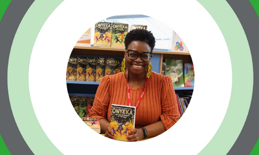 Portrait of Tola Okogwu the visiting author with a copy of her latest book